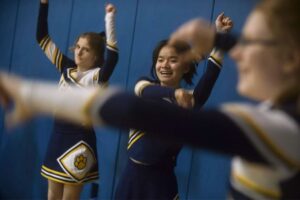 WPSD cheerleaders Krista Foster, left, Jia Fei Reeves, center, and Rebekah Quinn, right, cheer on their home court.