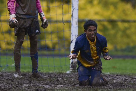 Seth Reeves, a senior soccer player for the Western Pennsylvania School for the Deaf reacts after a missed kick on goal left him face down in the mud during the third round of the Second Annual Eastern School for the Deaf Athletic Association soccer tournament.