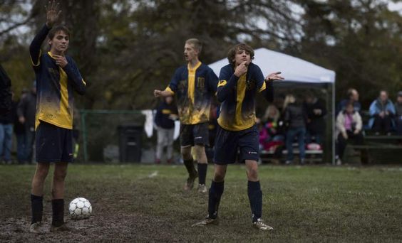 Western Pennsylvania School for the Deaf soccer player, Kyle D'Amore (right) signs to his coaches as fellow player, Chad D'Amore stands by during the third round of the Second Annual Eastern School for the Deaf Athletic Association soccer tournament.