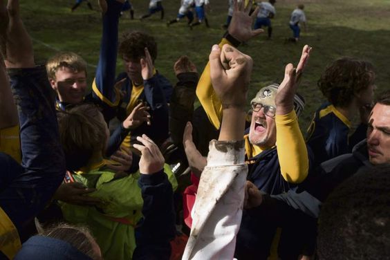 Valentine Wojton III, Athletic Director and soccer coach for the Western Pennsylvania School for the Deaf soccer team leads his players in celebration after winning the third round of the Second Annual Eastern School for the Deaf Athletic Association soccer tournament at WPSD campus in Swissvale,
