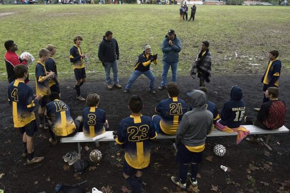 Valentine Wojton III, Athletic Director and soccer coach for the Western Pennsylvania School for the Deaf soccer team signs to players at halftime during the third round of the Second Annual Eastern School for the Deaf Athletic Association soccer tournament.